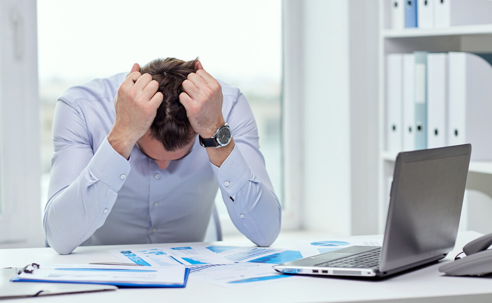Stressed man struggling with finances