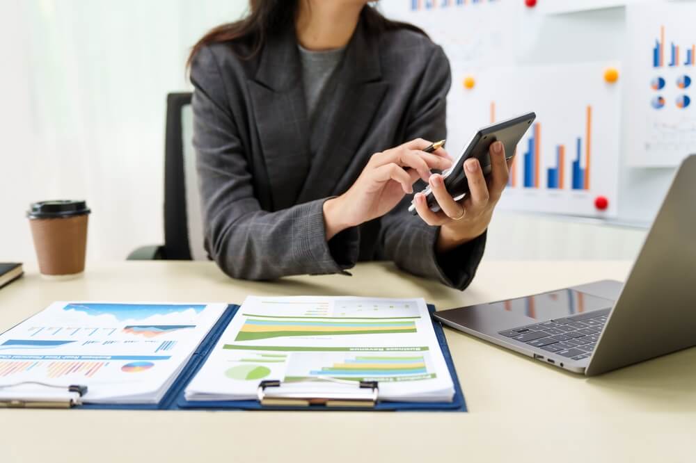 Businesswoman on a calculator